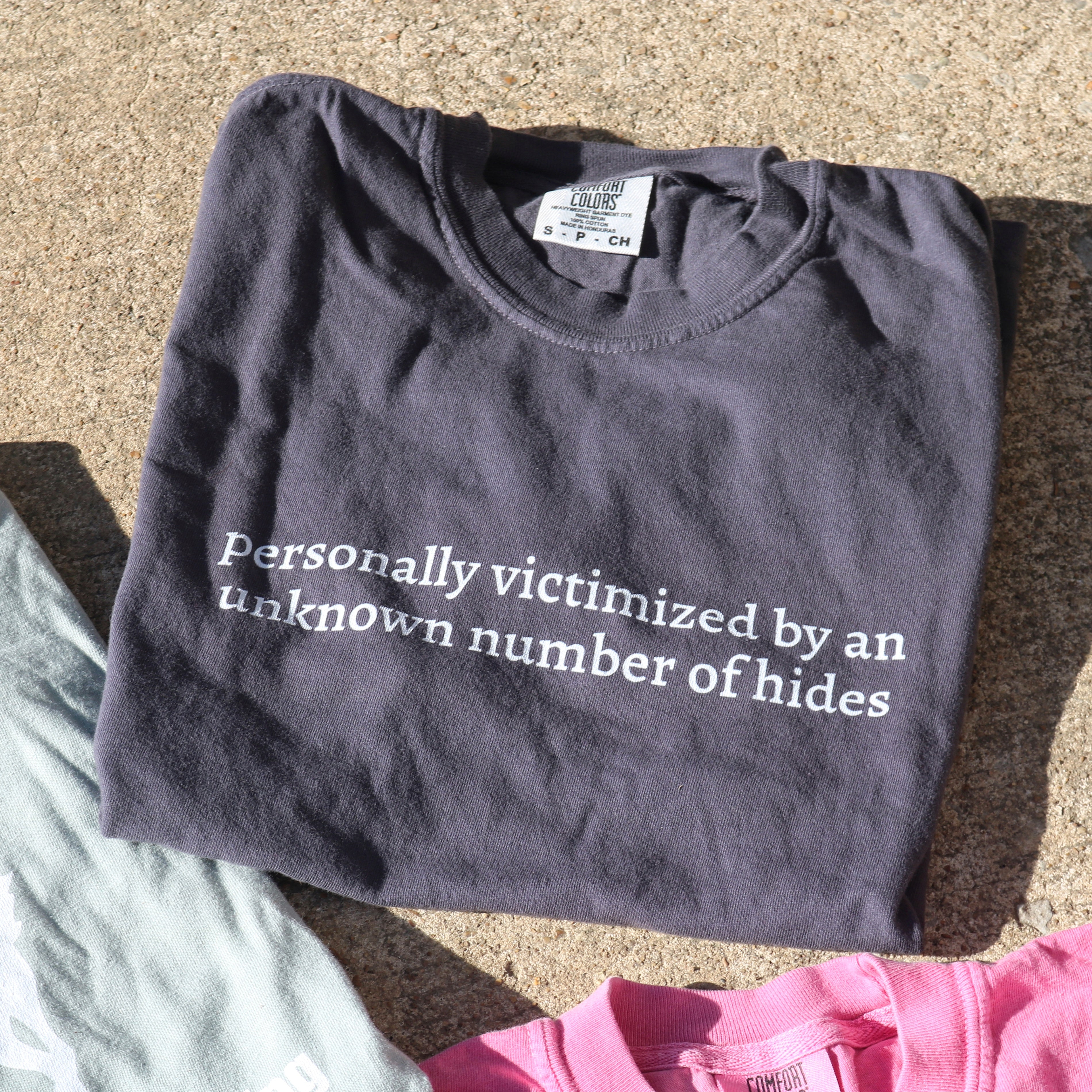 Personally Victimized By An Unknown Number of Hides - Unisex garment-dyed heavyweight t-shirt